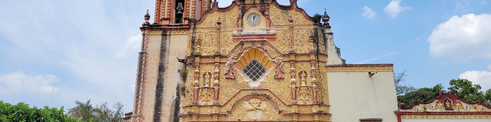 A historic church with ornate architecture and a bell tower.