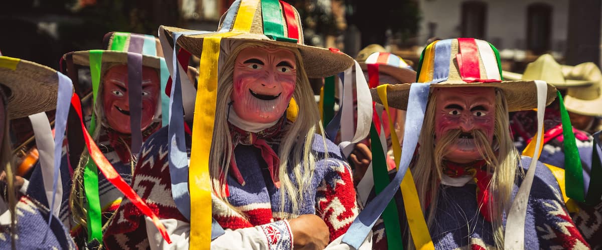 People wearing colorful hats and traditional clothing.