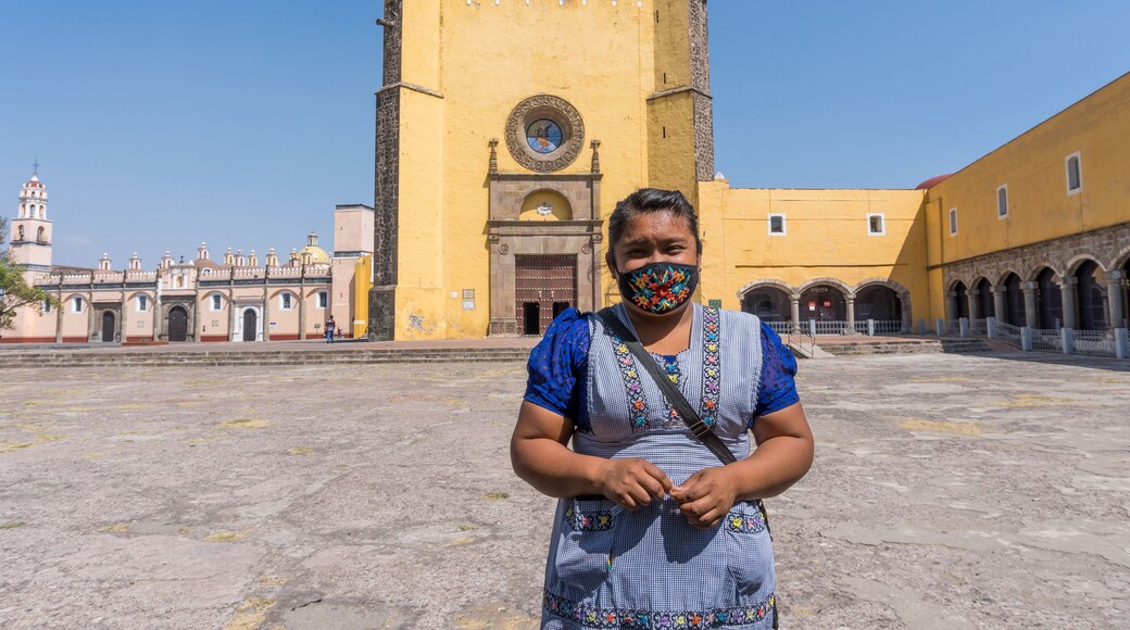 A Hispanic female standing at tThe Convent of San Gabriel Arcangel in Cholula, Mexico