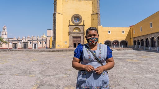 A Hispanic female standing at tThe Convent of San Gabriel Arcangel in Cholula, Mexico