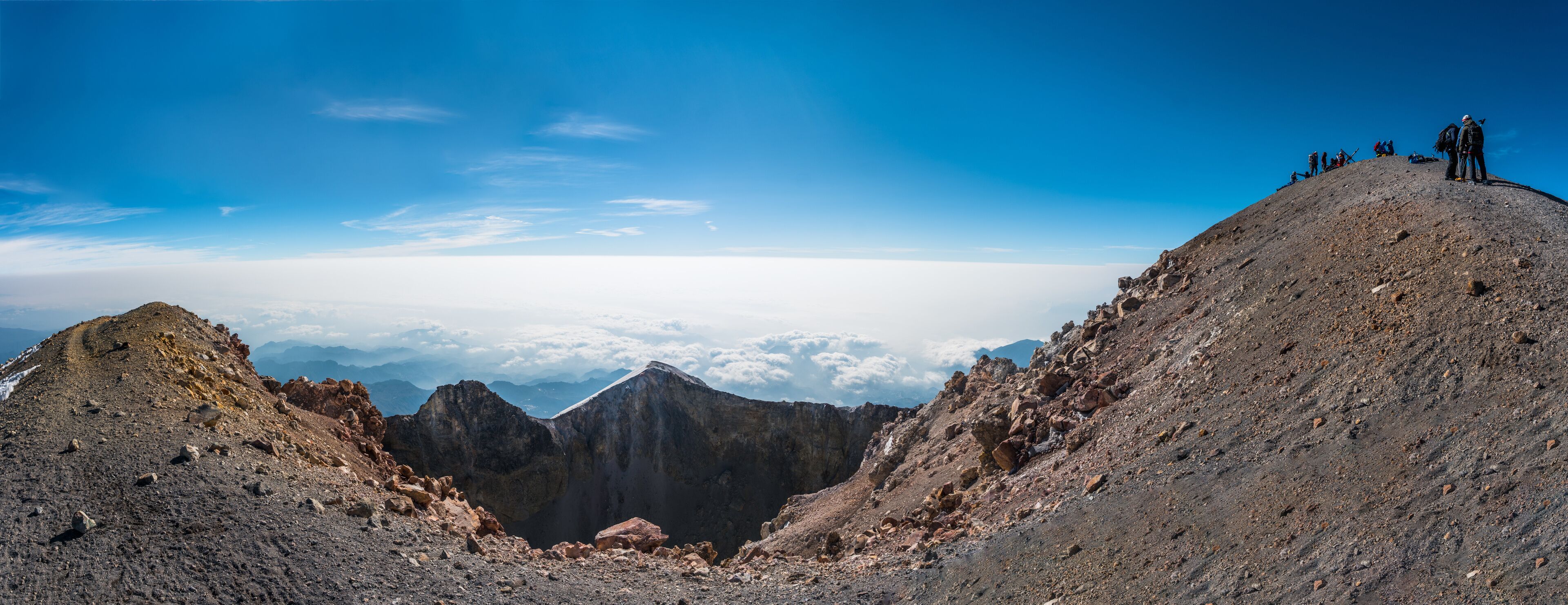A mountain landscape with rocky terrain and a clear sky.