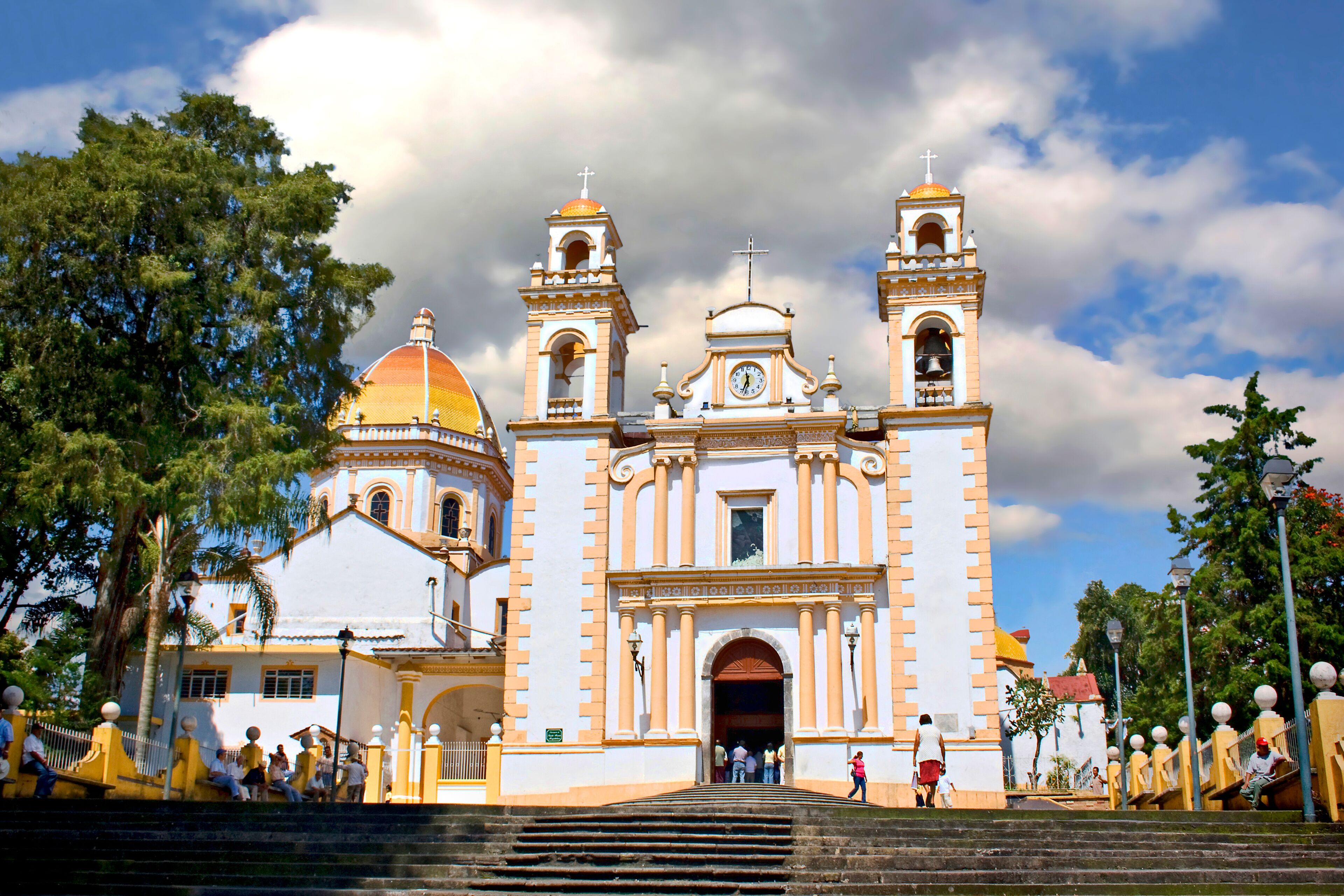 A historic church with two bell towers and a dome.