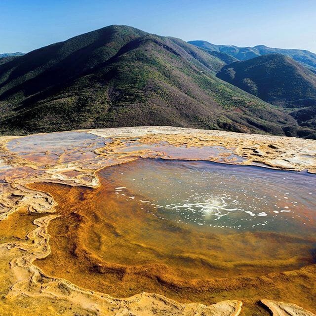 Gas bubbles in a mineral pool on top of Oaxaca's Hierve el Agua. The mineral filled water slowly leaks over the mountain's edge and has formed a giant stone waterfall as time has past. The incredible Mexican scenery surrounding the "Stone Falls" doesn't hurt either ;-) #Oaxaca #Mexico #Nature #HierveelAgua