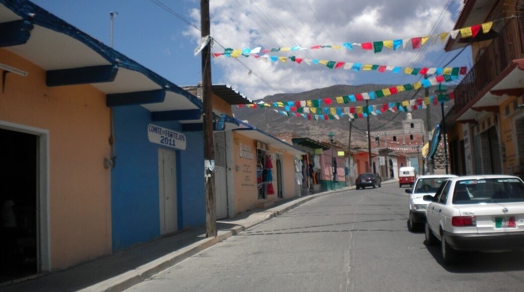 Walking through a the small town of Mitla, Oaxaca on our way to old Zapotec ruins. El papel picado, the colorful store fronts, and blue sky was an experience. Nothing special or touristy about it, just breathe-taking.