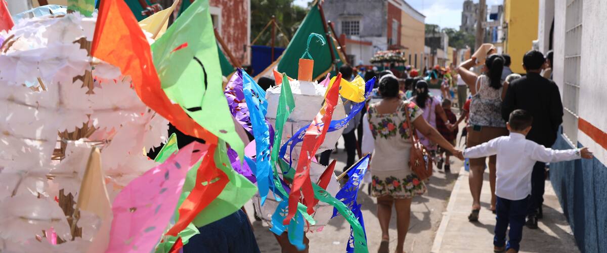 A street lined with colorful decorations and buildings.