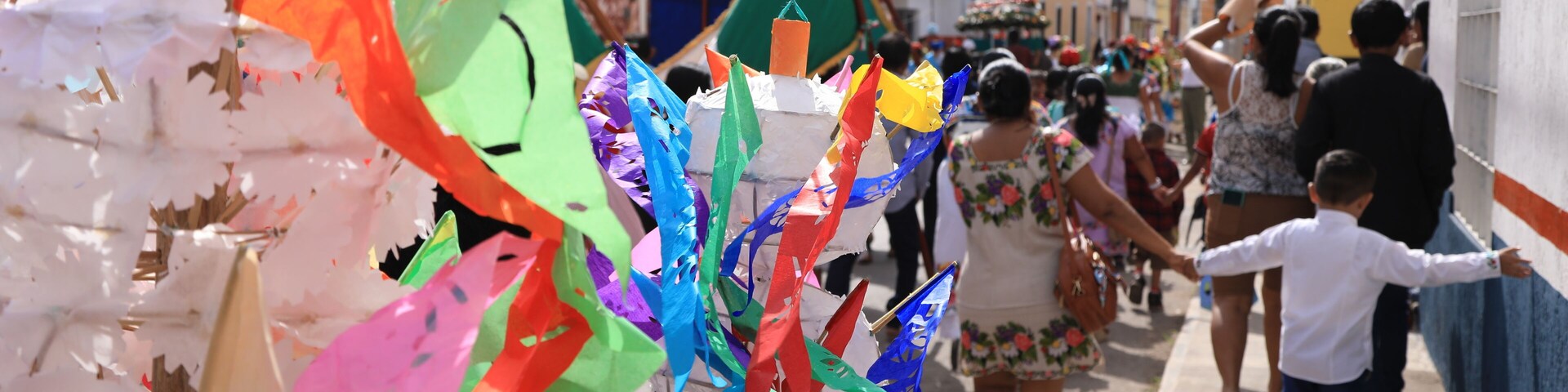 A street lined with colorful decorations and buildings.