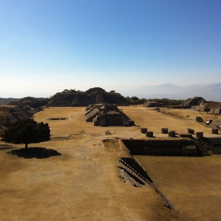 An ancient archaeological site with ruins and a clear sky.