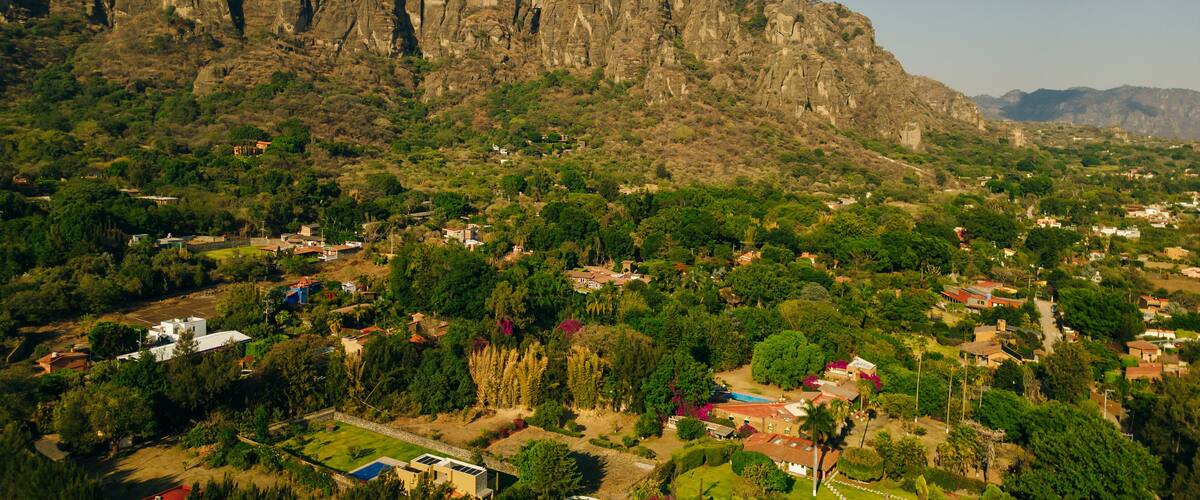A mountainous landscape with a village nestled in the valley.