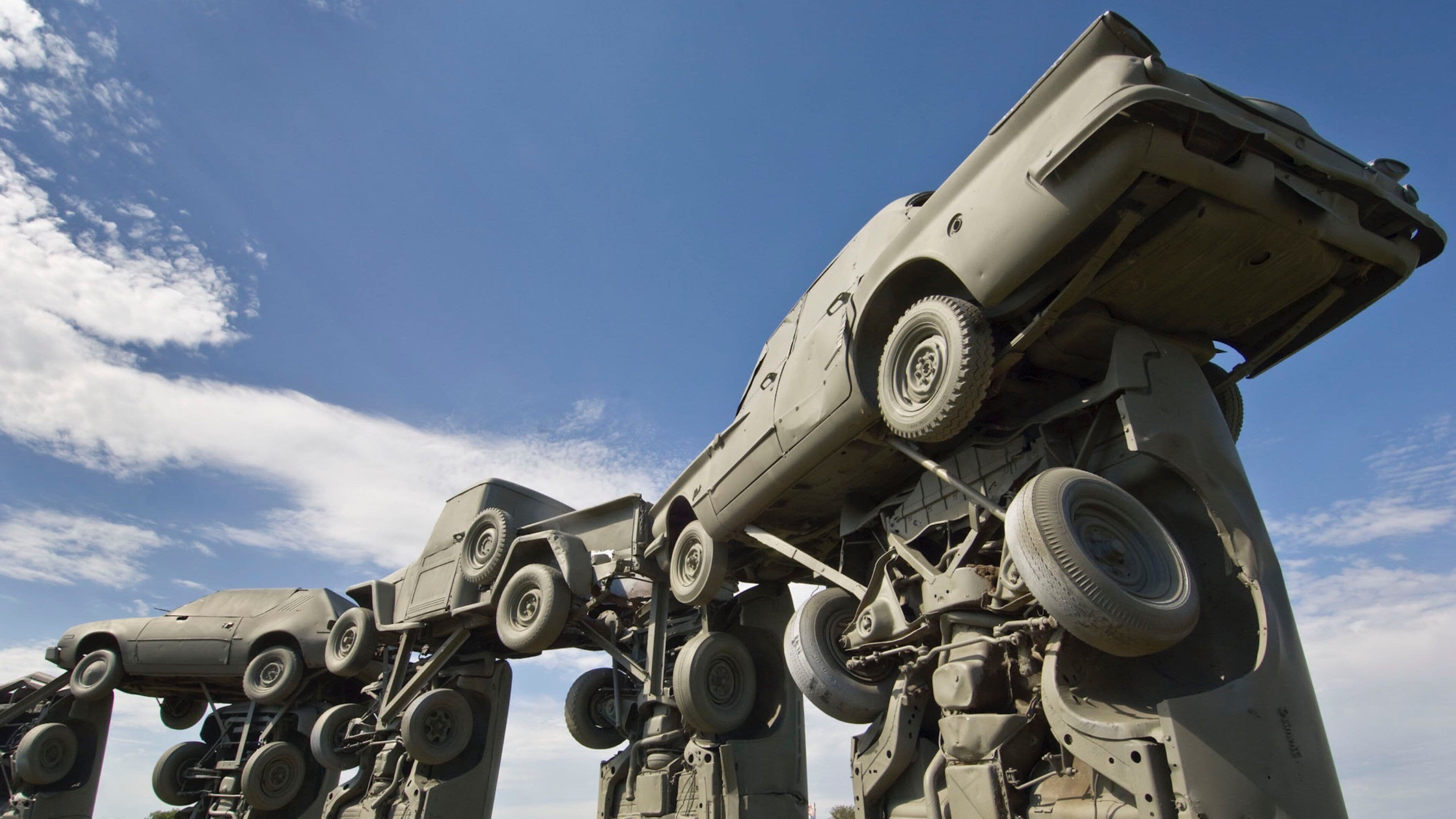A military vehicle with a large, elevated platform and multiple wheels.