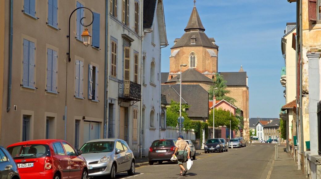 Tarbes showing a city and street scenes as well as an individual male