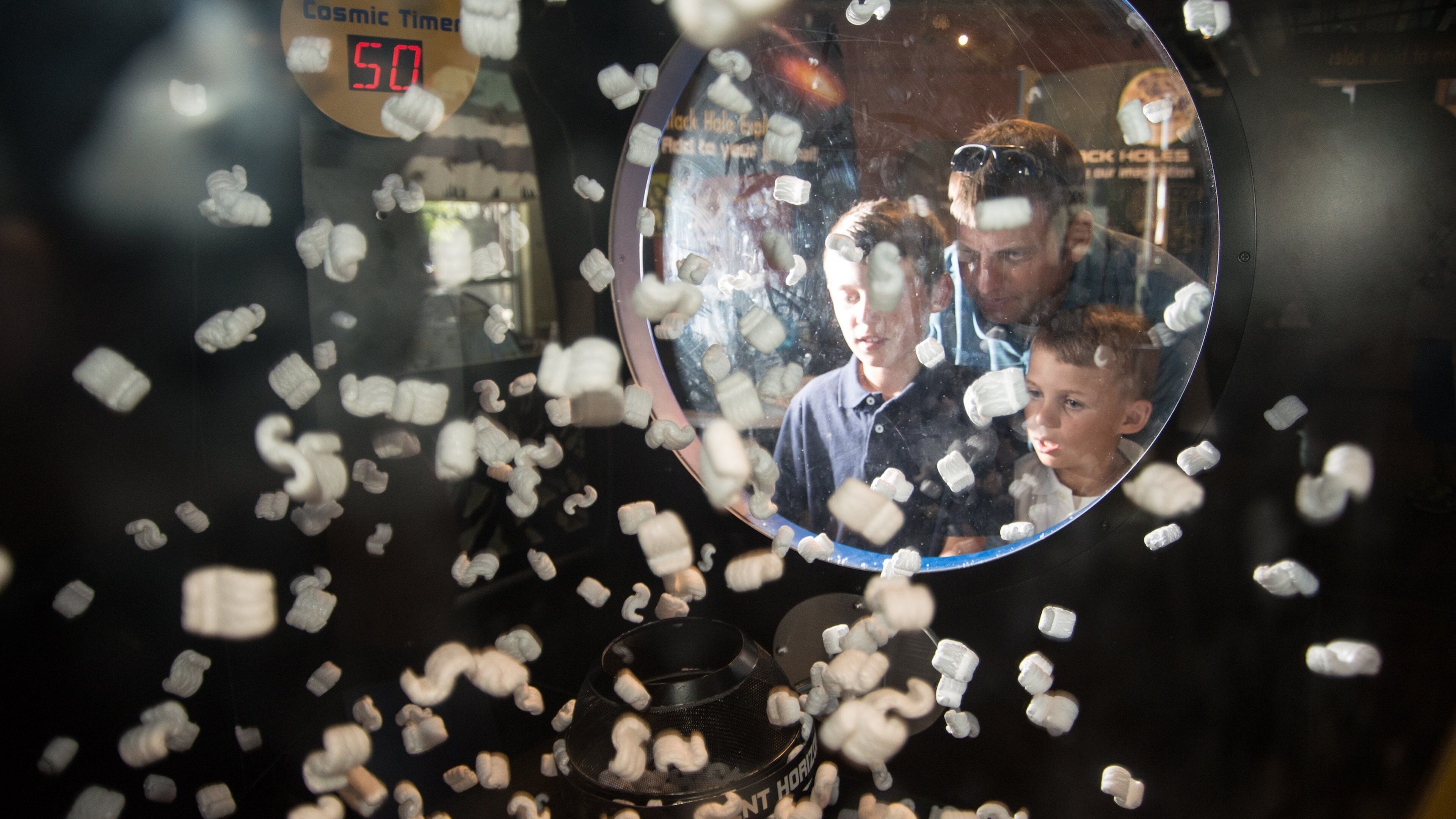 Exploration Works showing interior views as well as a family