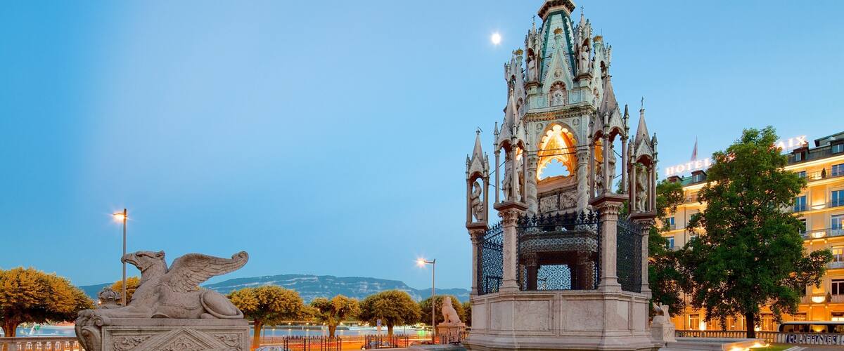 Geneva showing a square or plaza, night scenes and heritage elements