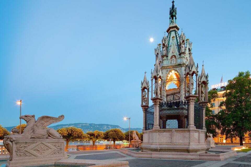 A Gothic-style monument with intricate carvings and a statue of a lion.