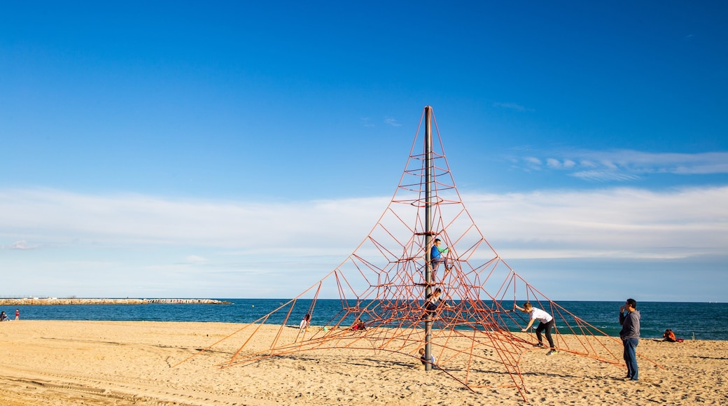 Llevant Beach featuring a playground, general coastal views and a beach