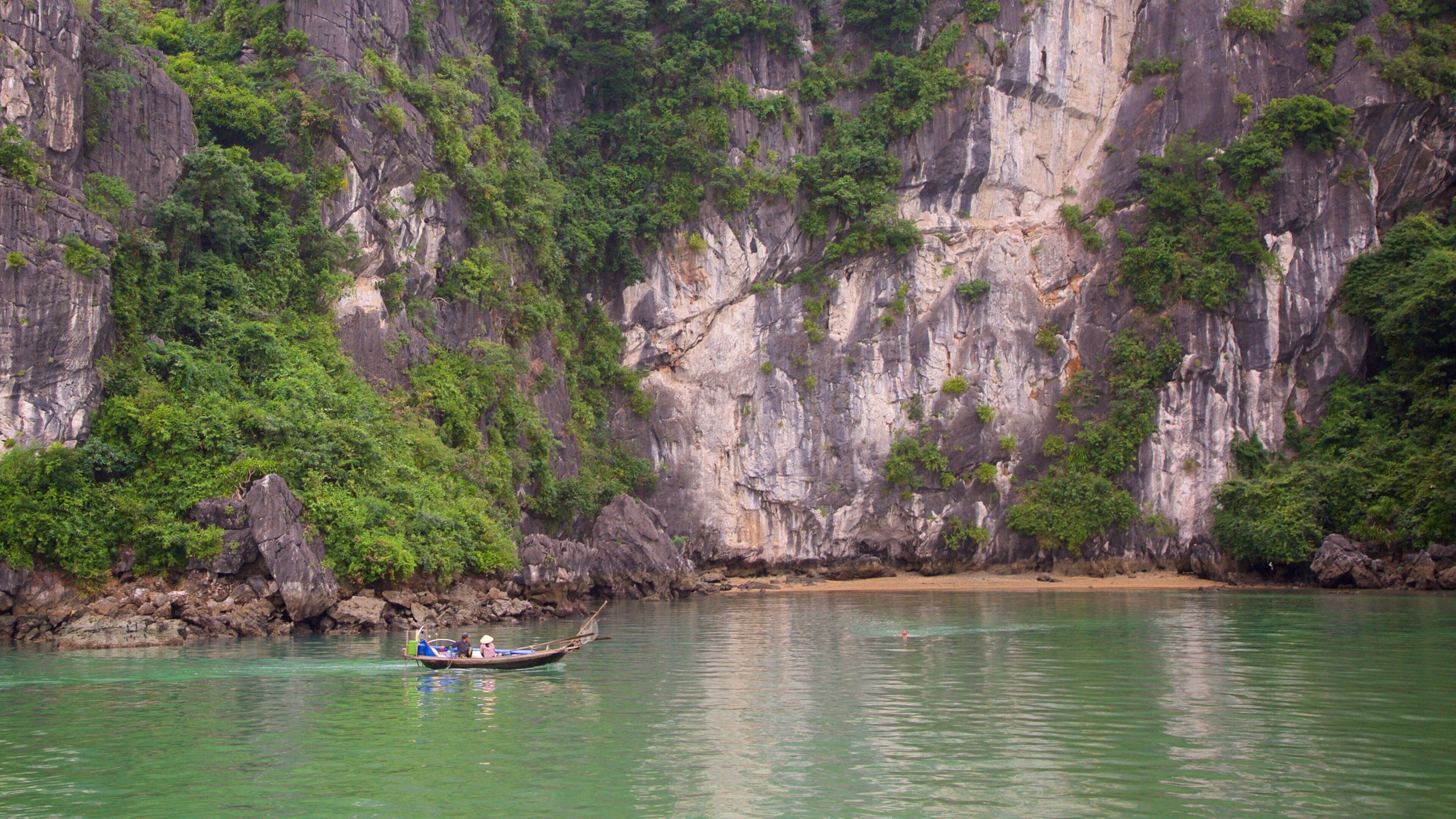Halong Bay which includes a bay or harbour and boating