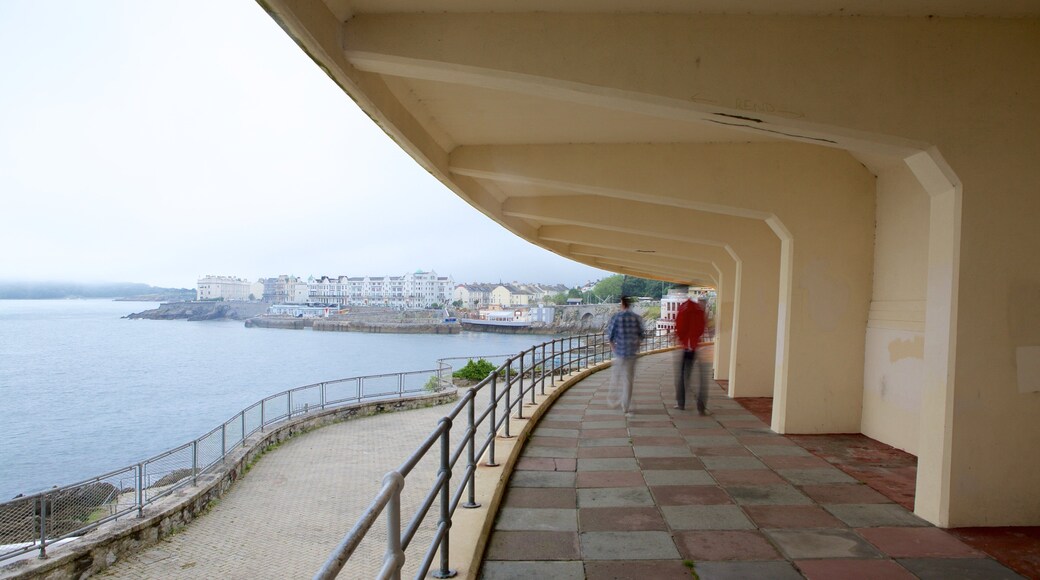 Plymouth showing general coastal views as well as a small group of people
