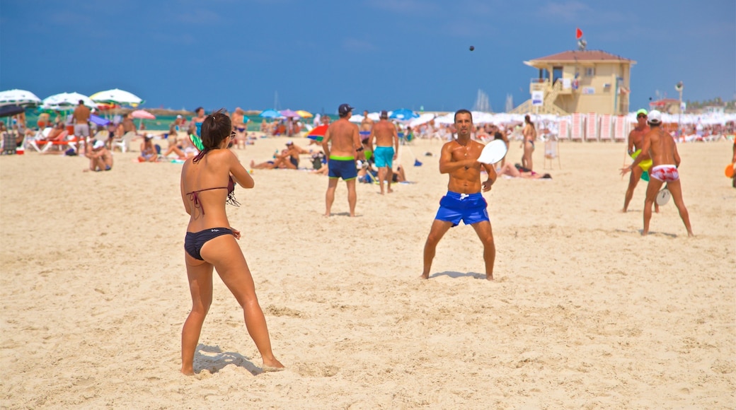 Tel Aviv showing a sandy beach and general coastal views as well as a couple