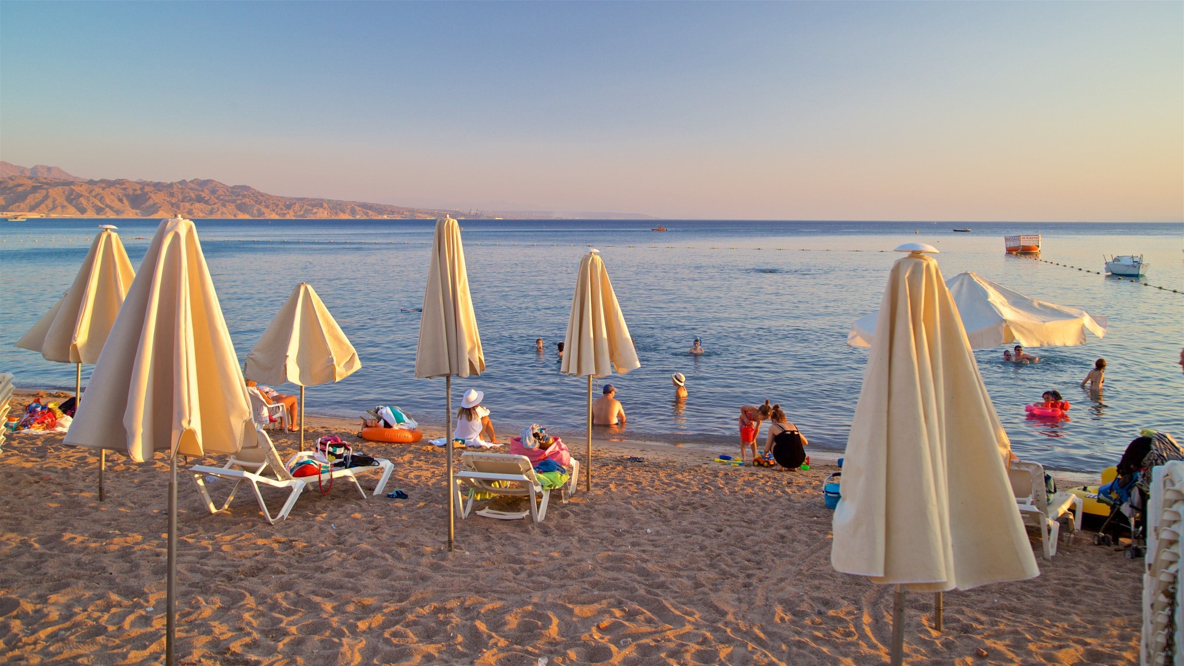 Eilat which includes a sunset, general coastal views and a sandy beach