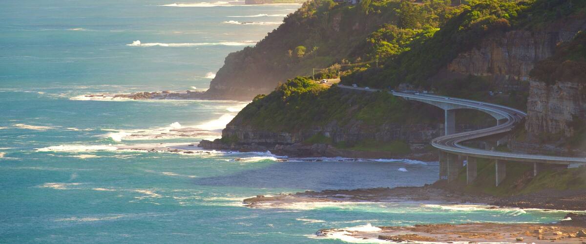 A coastal highway winding along a cliffside, overlooking the ocean.