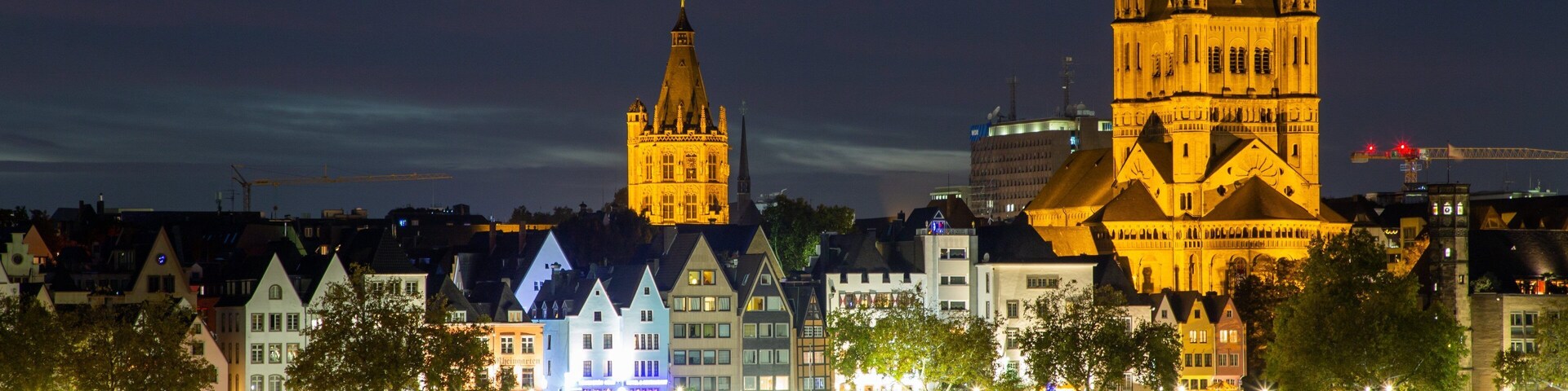 Cologne which includes a river or creek, night scenes and a city