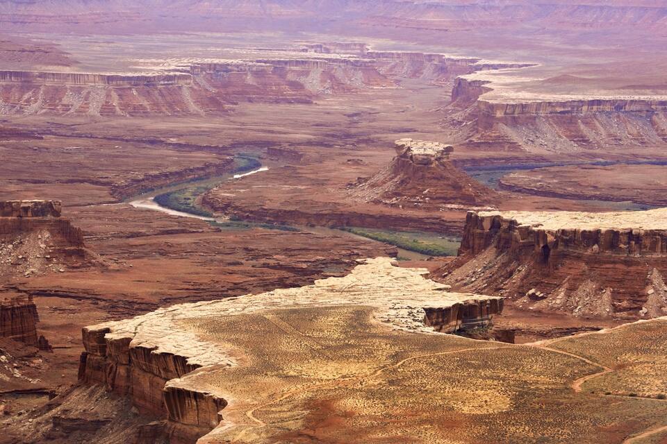 A canyon with a river flowing through it.