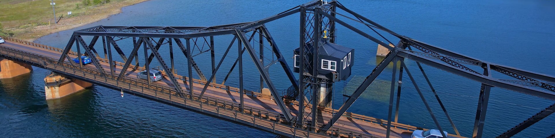 Aerial view of single lane traffic on Little Current Swing Bridge, Manitoulin Island. The bridge crosses North Channel on Highway 6. The historic bridge will be replaced with new two lane bridge.