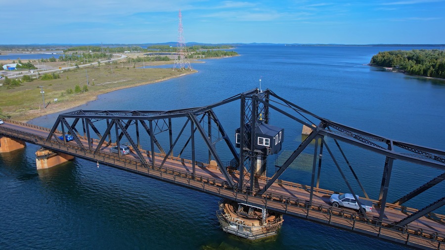 Aerial view of single lane traffic on Little Current Swing Bridge, Manitoulin Island. The bridge crosses North Channel on Highway 6. The historic bridge will be replaced with new two lane bridge.