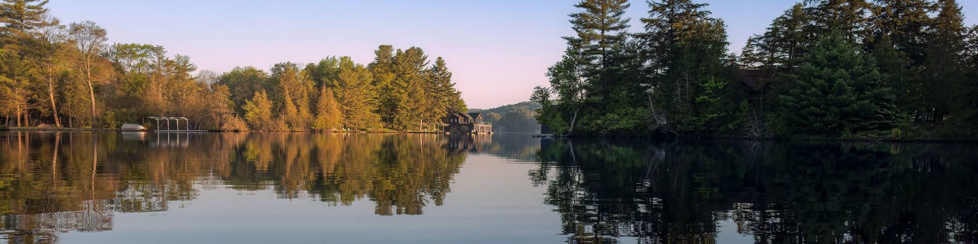 Springtime kayaking along the shores of Joseph Lake in the Muskokas of Ontario, Canada