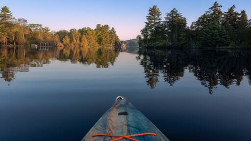 Springtime kayaking along the shores of Joseph Lake in the Muskokas of Ontario, Canada