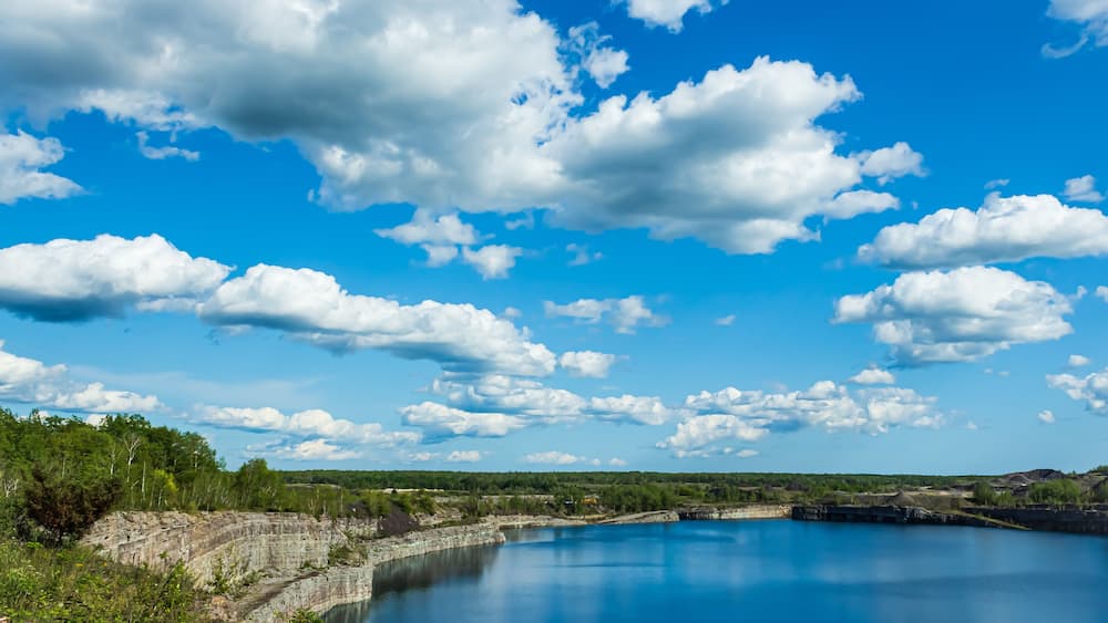 Marmora Mine flooded with vibrant blue water, Marmora, Ontario, Canada