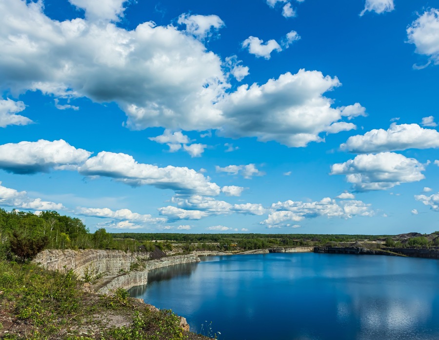 Marmora Mine flooded with vibrant blue water, Marmora, Ontario, Canada