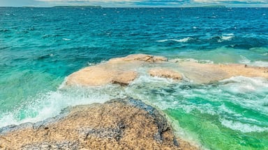 Colourful green waters at Indian Head Cove on lake Huron in Bruce Peninsula National Park and clear blue water in Ontario, Canada. Located between The Grotto and Overhanging rock tourist attractions.