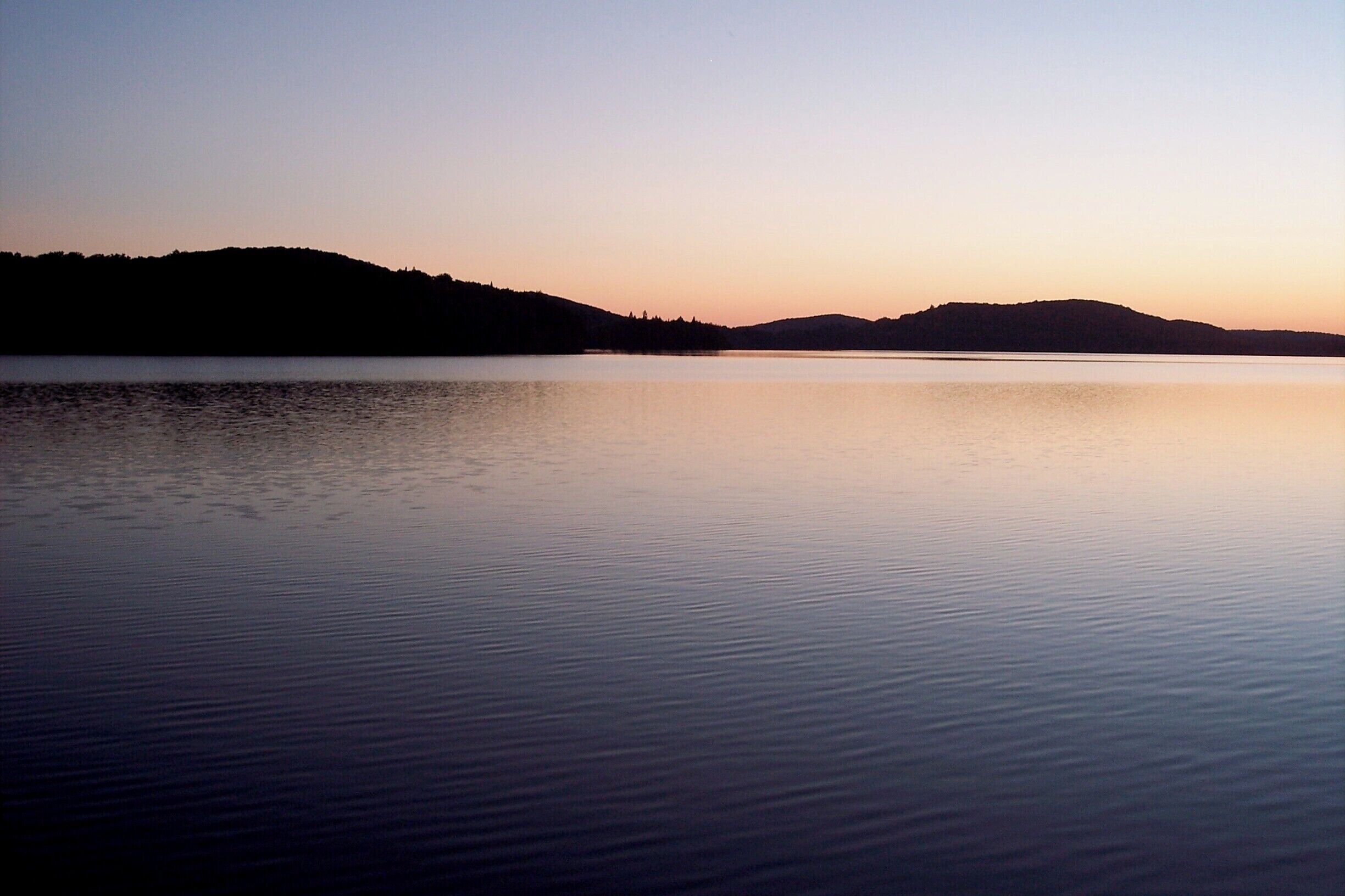Not a ripple nor a slash nor a sound, until some loons came along. #lakes #forests #colorful