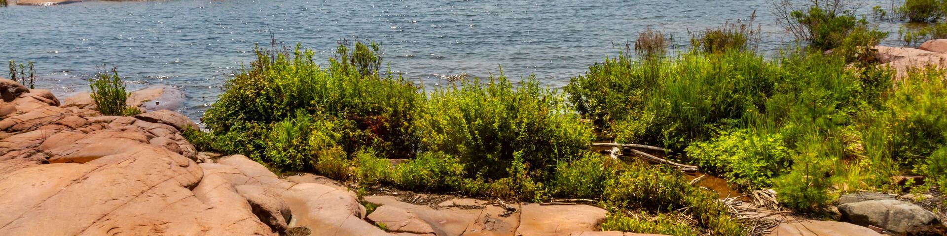 Chikanishing trail. Red granite rocks on the north shore of Georgian Bay. Lake Huron. Killarney Provincial Park, Ontario, Canada.