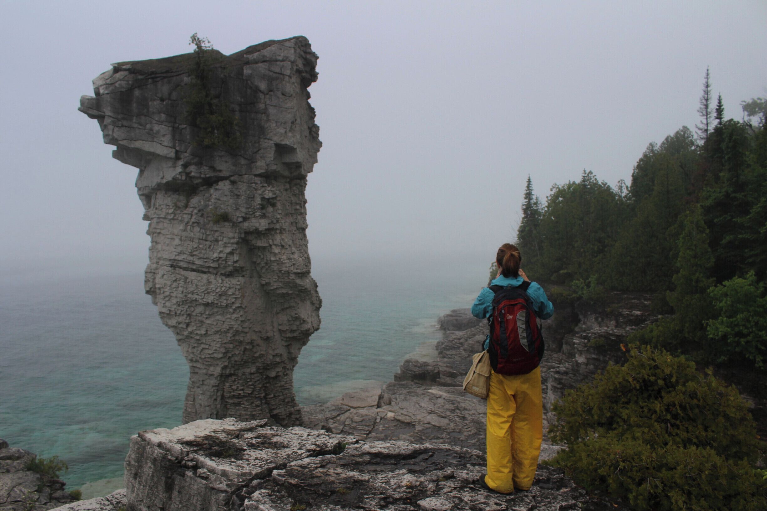 Flower Pot island is over visited (but still worth it). If you're a photographer, love jumping around on rocks, or just like exploring, the island has six primitive campsites you should look into. You need to book a campsite in advance but it is worth it; from the evening until mid-morning you have the island almost to yourself (only 5 other campers). Lots of fun (even if it's raining like in this photo).