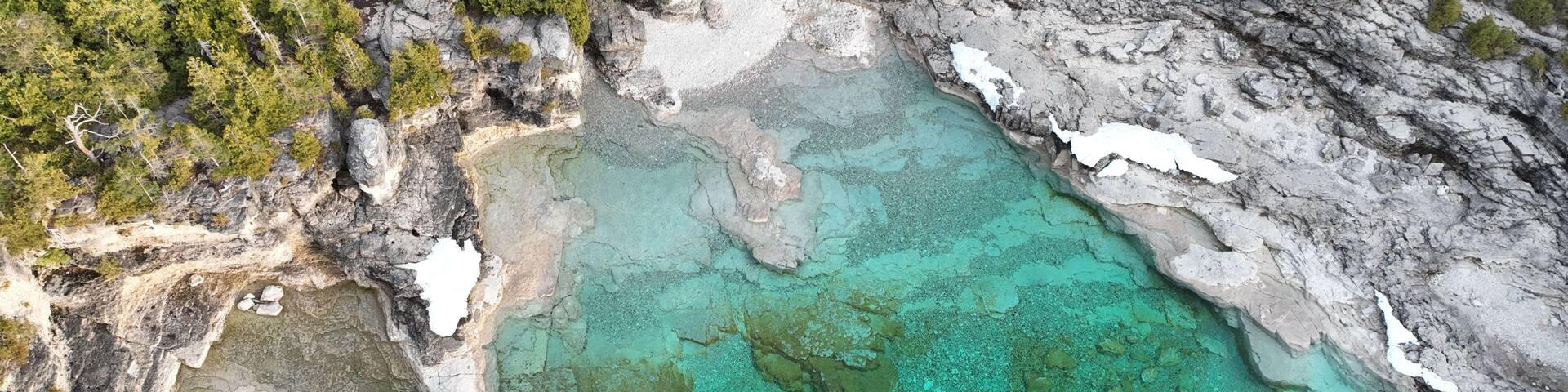 Bird's eye view of turquoise waters of Bruce Peninsula Park in Ontario, Canada