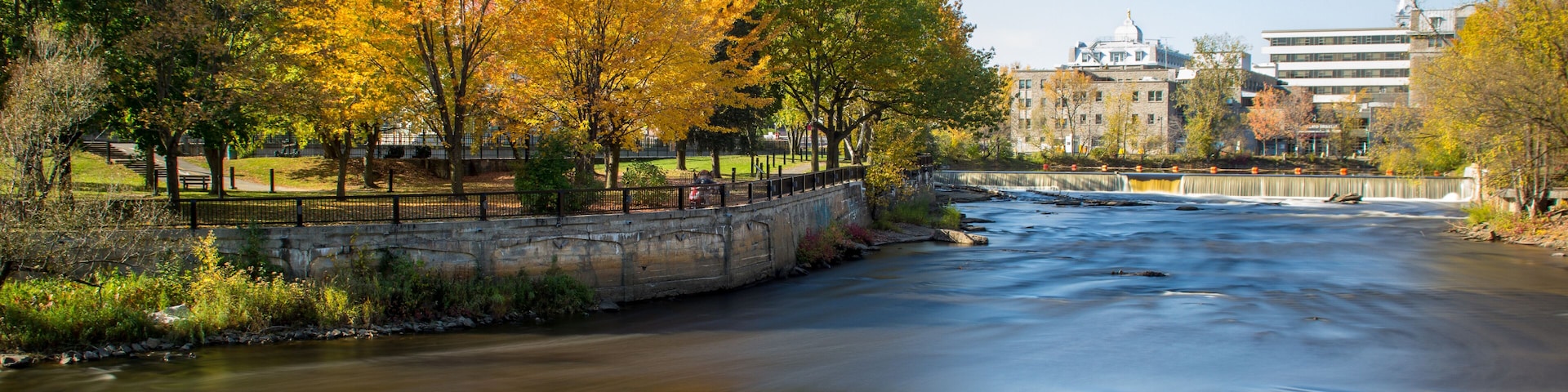 Slow motion streaming water. Waterfalls in L'Assomption river, Joliette, Quebec, Canada