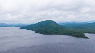 Lac-Jacques-Cartier featuring general coastal views and mist or fog