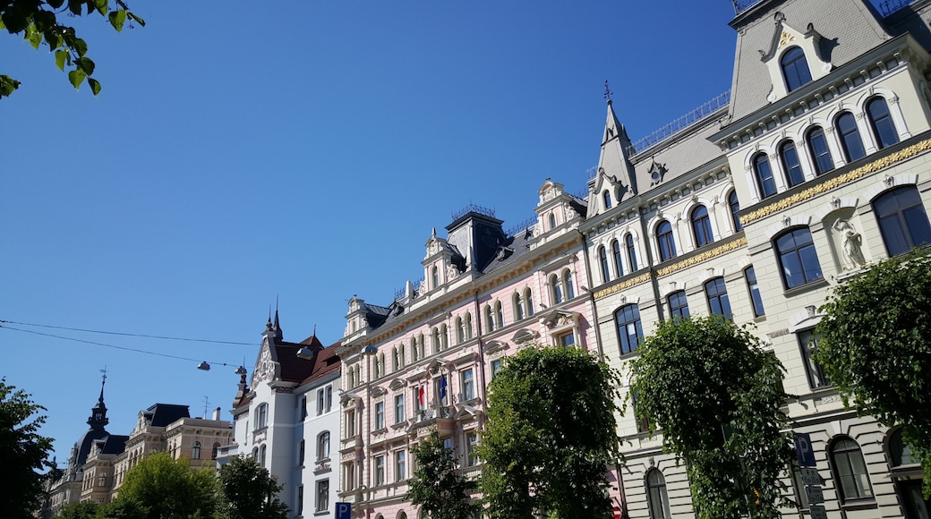 A historic building with ornate architecture and a clear blue sky.