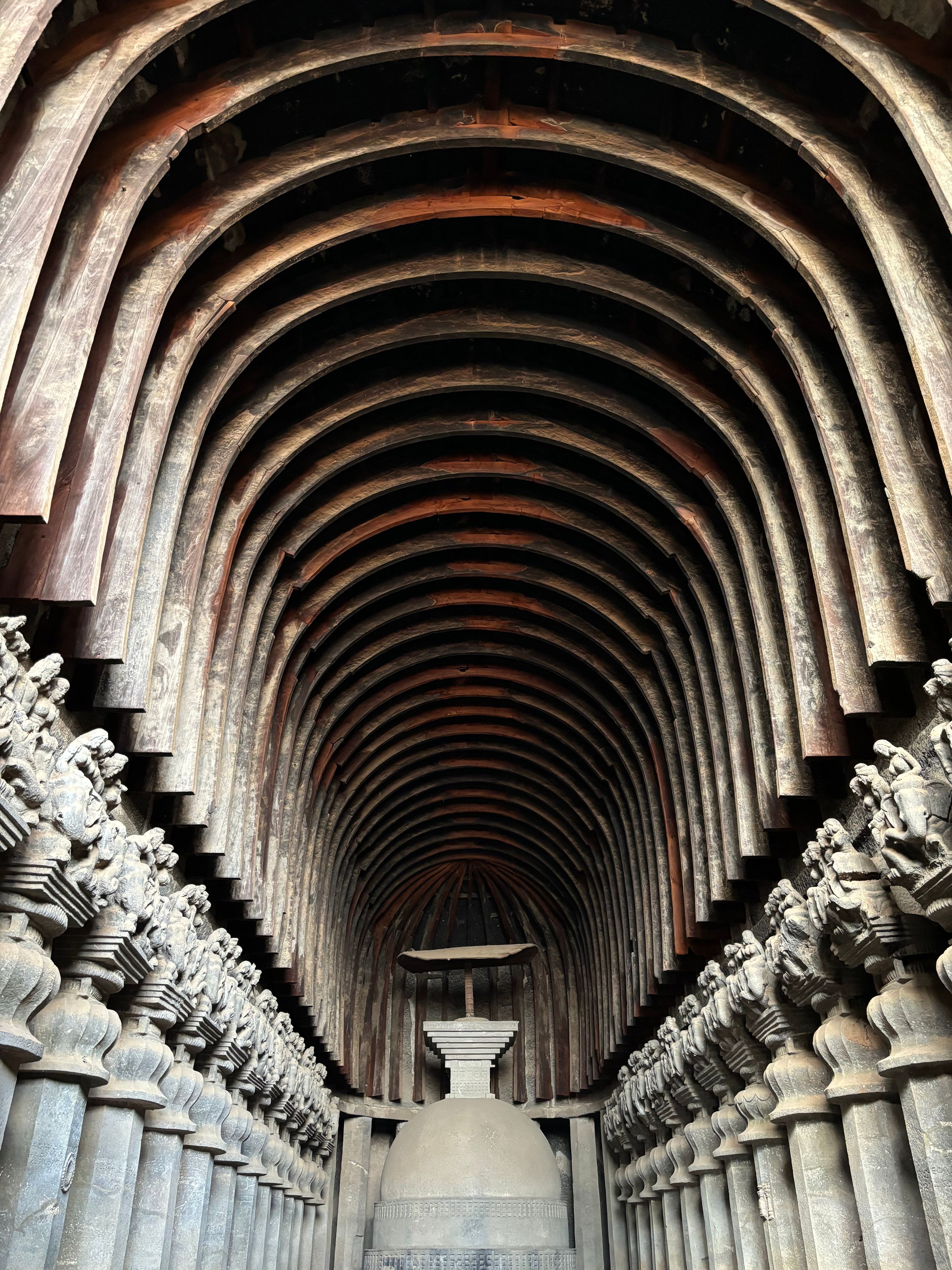 A series of arches with intricate carvings and a central dome.