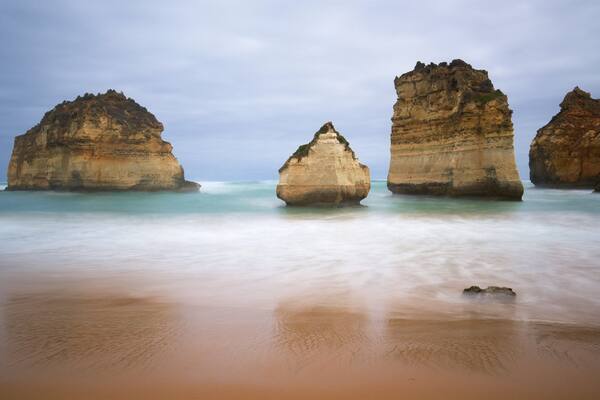 Sandy Cove which includes rugged coastline, general coastal views and a beach