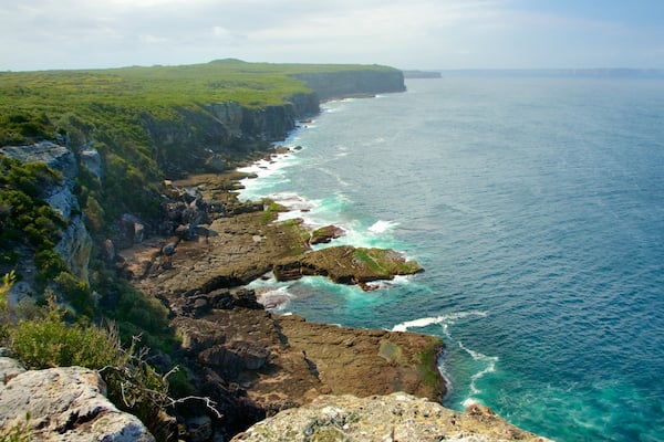 Sanctuary Point which includes surf and rugged coastline