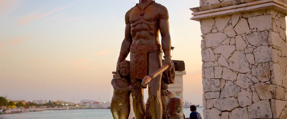 Cozumel showing a monument, a statue or sculpture and a sunset