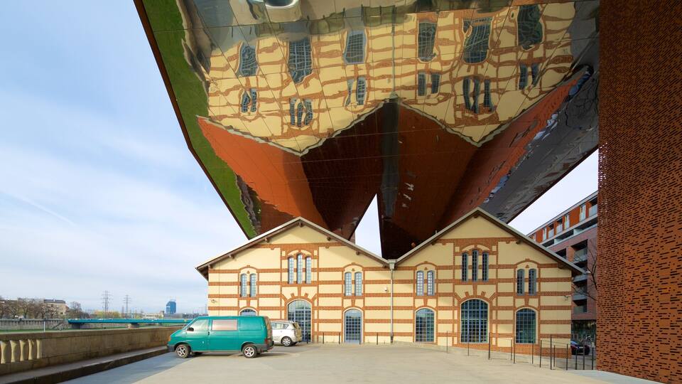 A building with a unique architectural design featuring a large, irregularly shaped overhang.