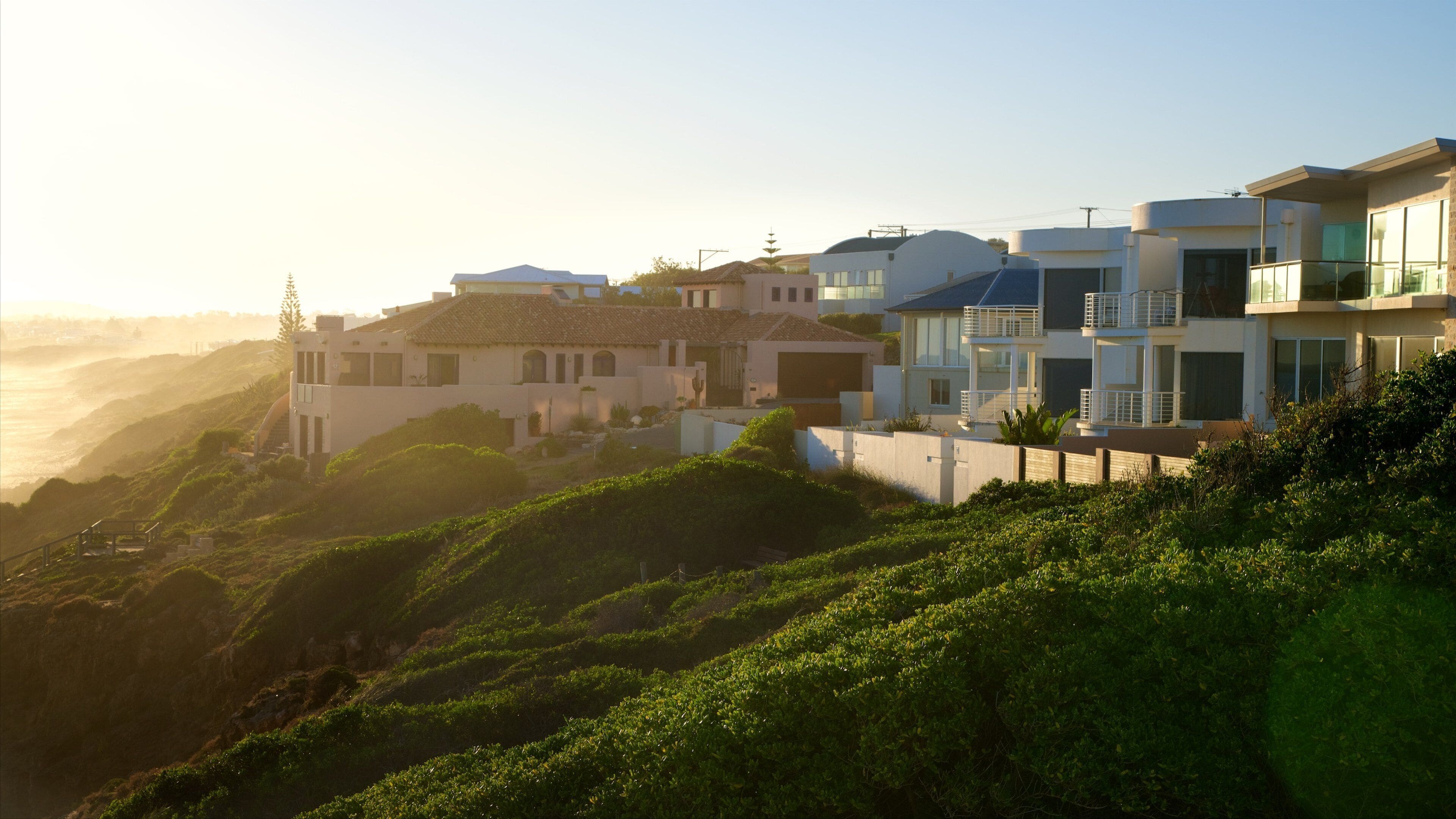 Knights Beach which includes a sunset, a coastal town and landscape views