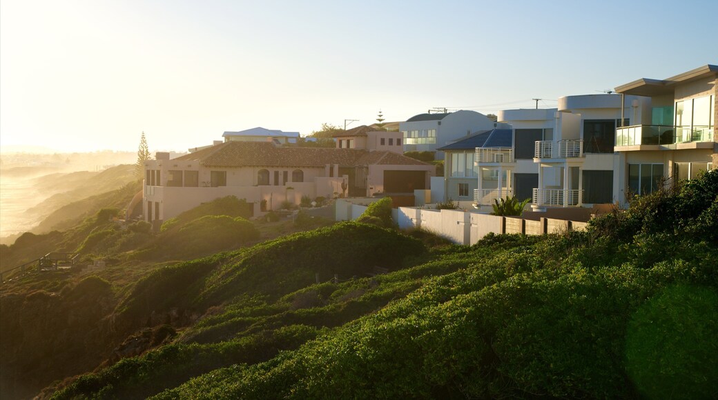 Knights Beach which includes a sunset, a coastal town and landscape views