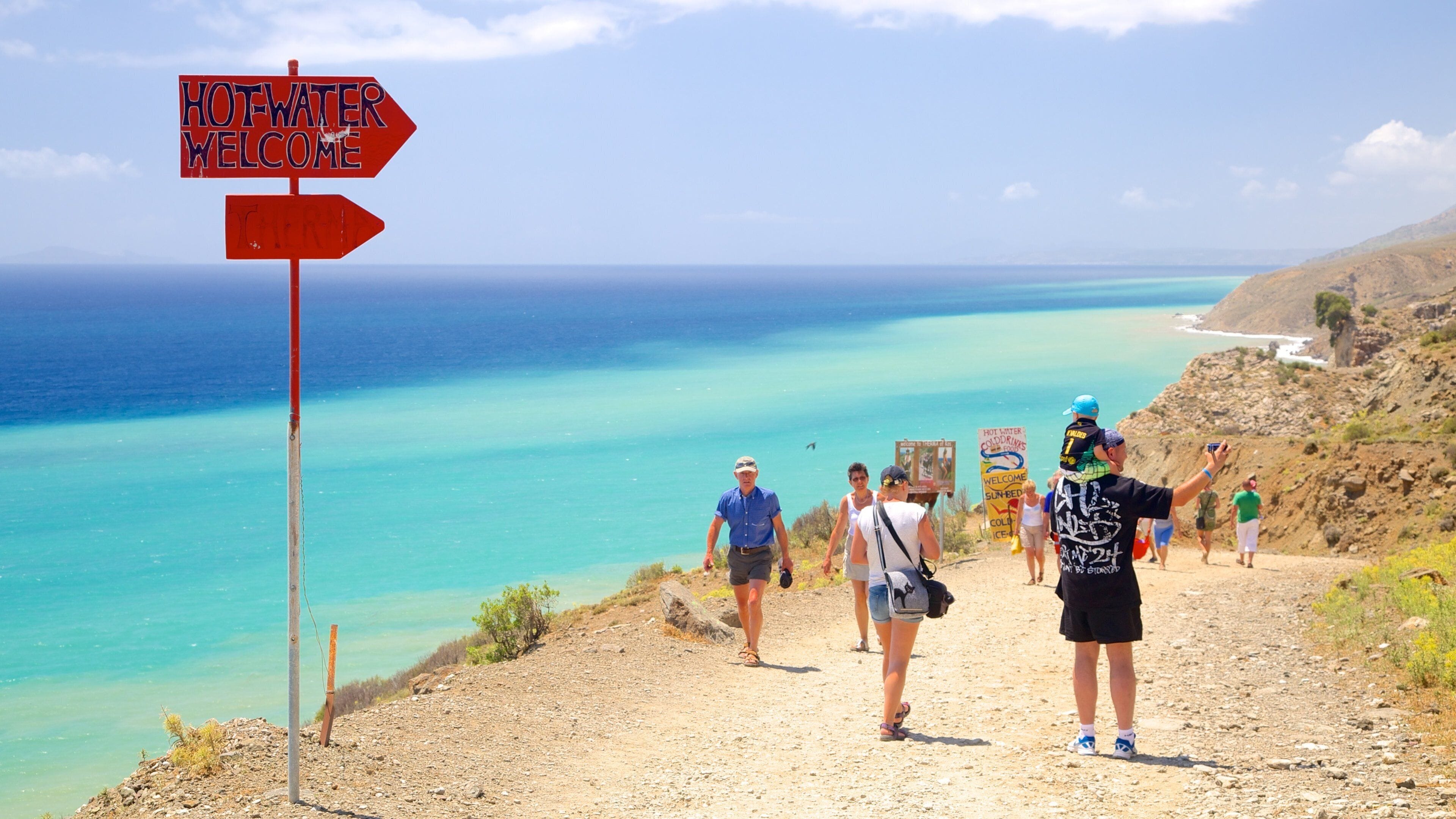 Therma Beach featuring general coastal views, signage and hiking or walking