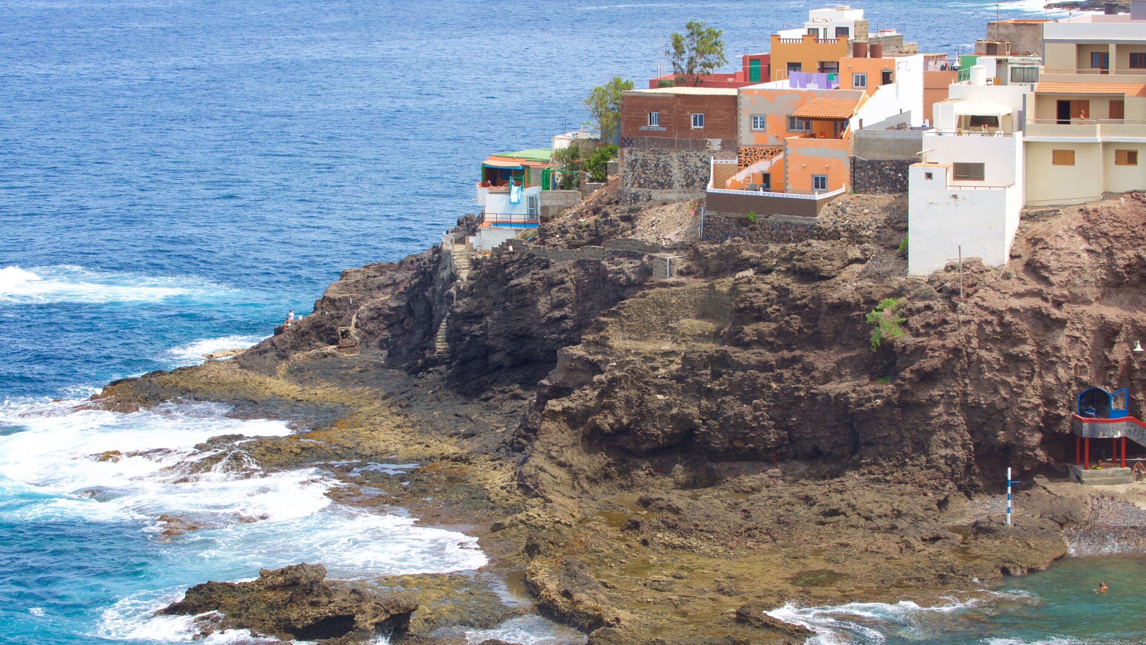 Gran Canaria which includes general coastal views, a pebble beach and a coastal town
