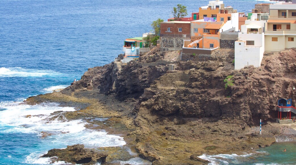 Gran Canaria which includes general coastal views, a pebble beach and a coastal town
