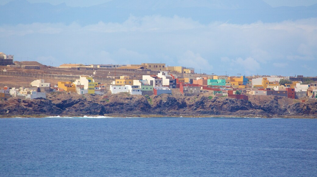 Caleta de Arriba which includes rocky coastline, general coastal views and a coastal town